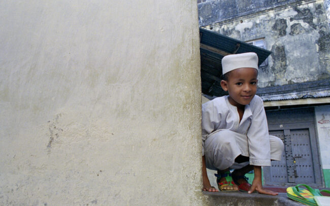 Boy on Ledge • Stone Town, Zanzibar, Tanzania